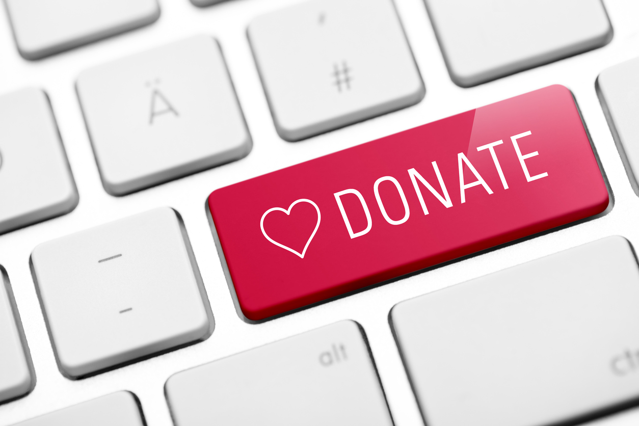 Button on keyboard with the word: Donate and a heart symbol.
